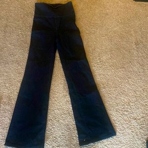 Dark blue Denim wash, high waisted, side zipper, wide leg with bell bottoms.